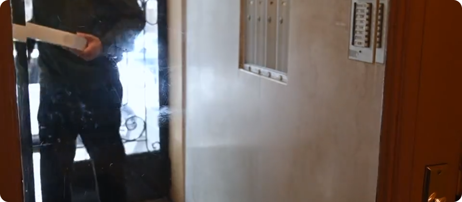 A visitor using a building entry intercom
